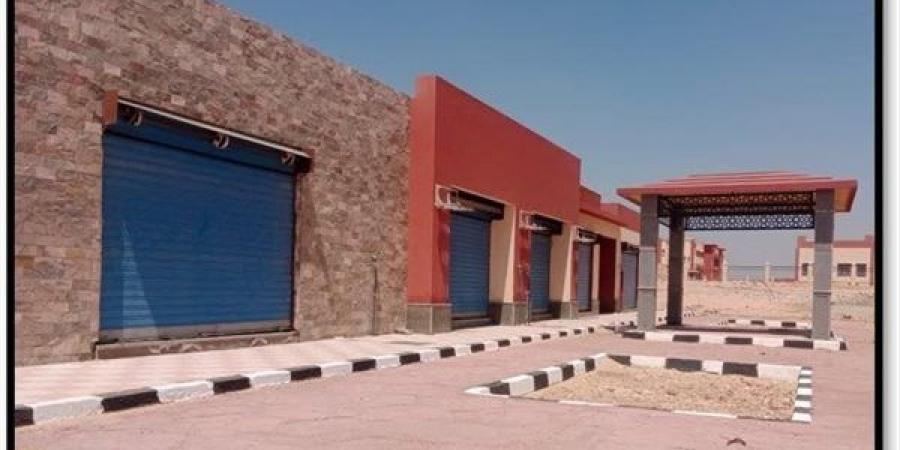 تسليم 266 قطعة أرض سكنية لمستحقيها وبيع 7 محال تجارية وصيدلية بملوي الجديدة